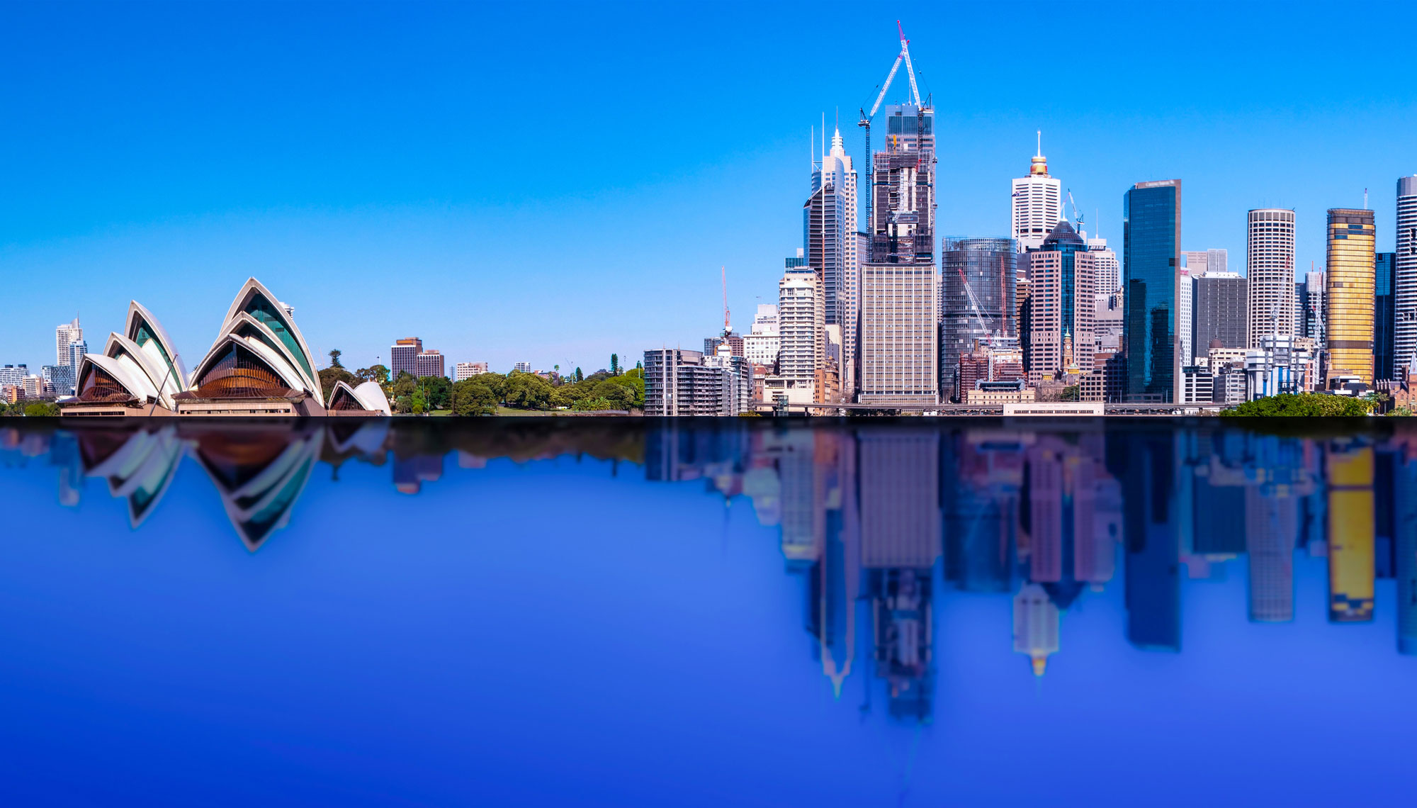 Sydney CBD skyline with reflection of buildings in the harbour waters