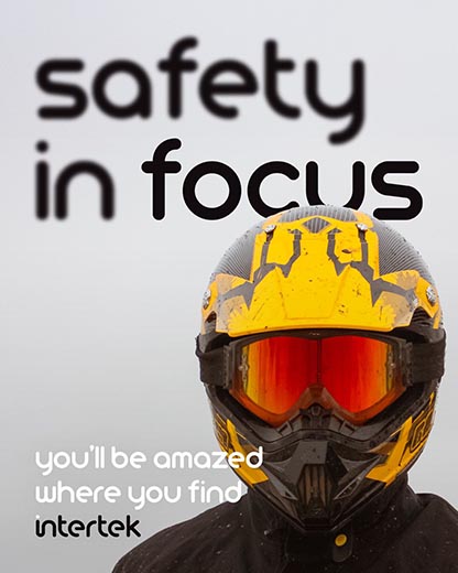 Person wearing protective colorful helmet and goggles